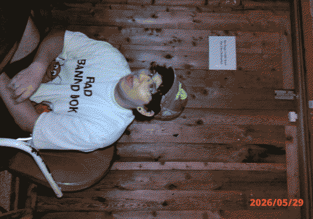 A photo of me sitting down, looking away from the camera.