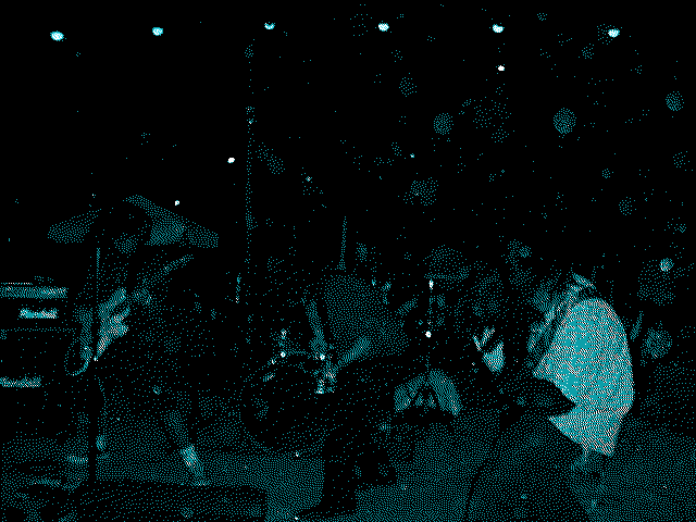 Like Shooting Stars performing in the dark